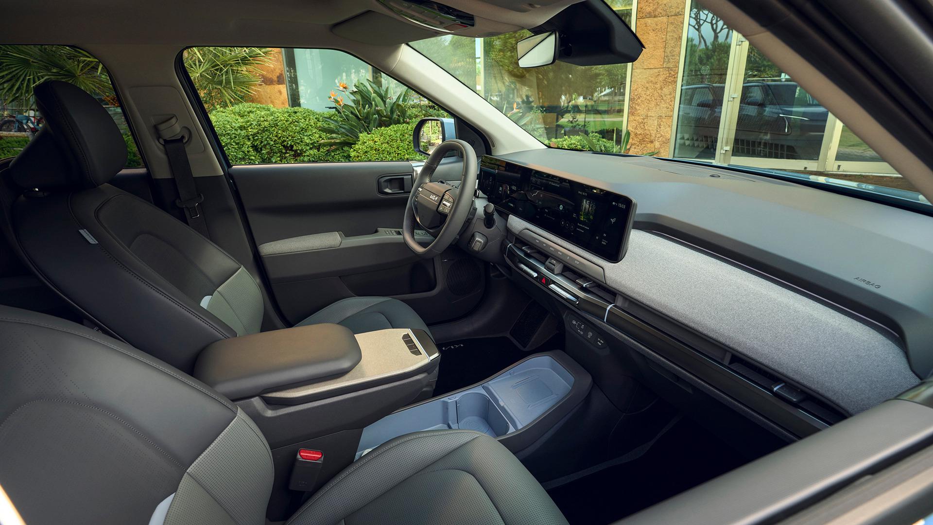 Kia EV3 cabin, showing the centre display and dark upholstery. Photo: Kia Europe