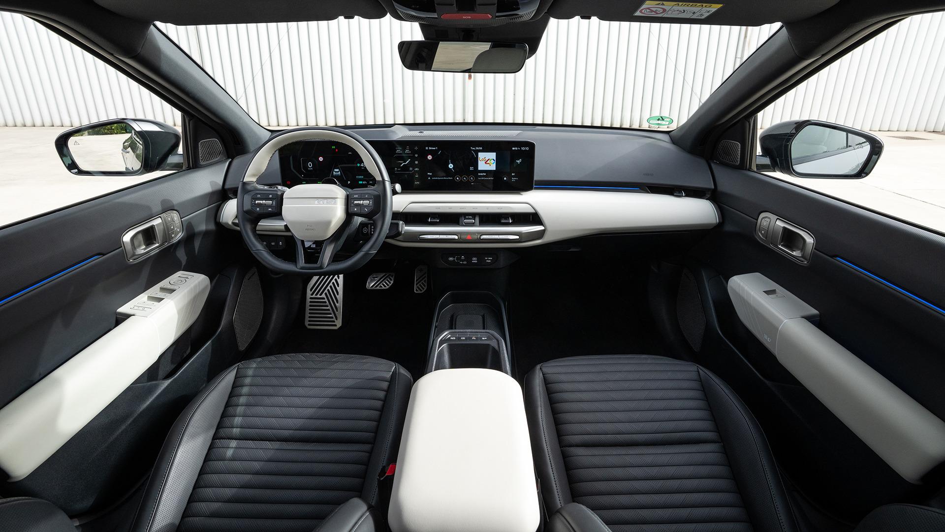 Kia EV4 Fastback cabin, showing the centre display and dark upholstery. Photo: Kia Europe
