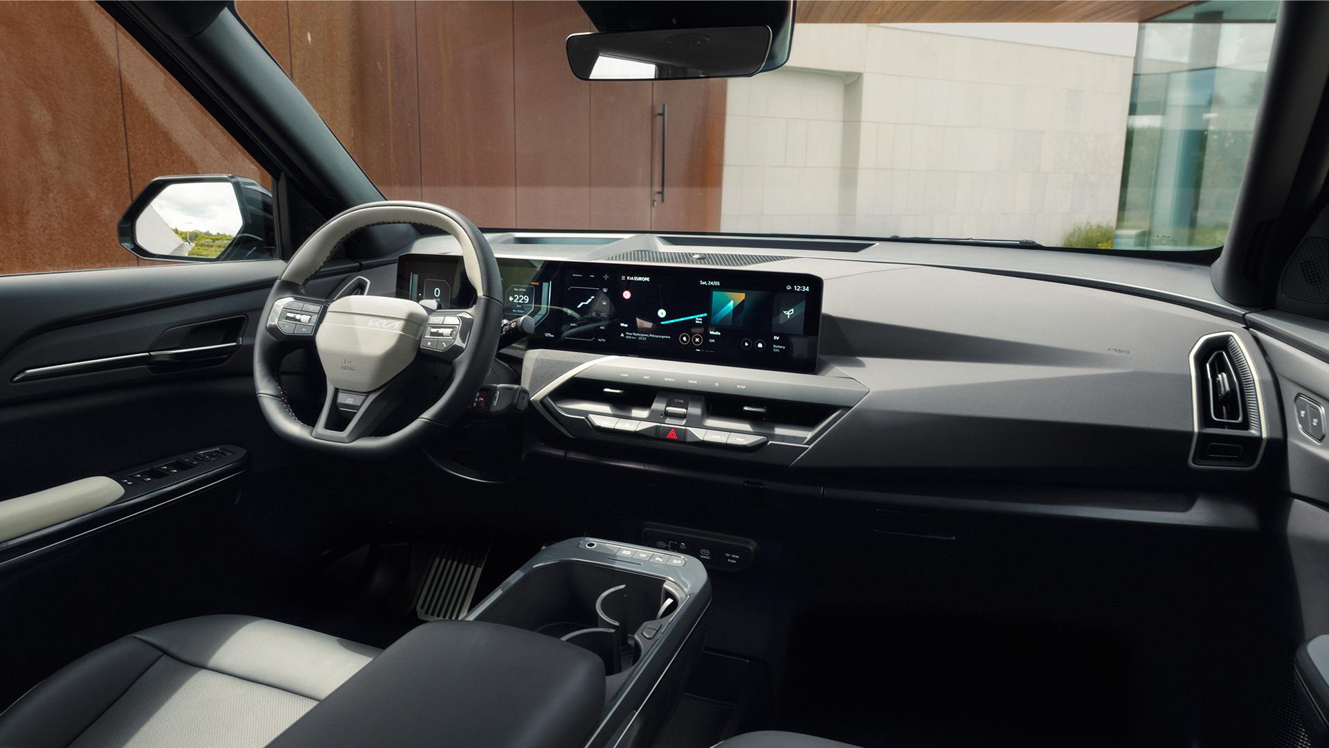 Kia EV5 cabin, showing the centre display and dark upholstery. Photo: Kia Europe