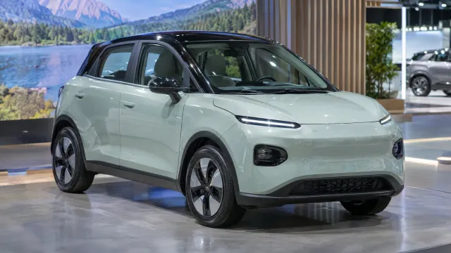 The Chery Q electric compact, a 4.19-metre car with a 41 kWh battery, on the Chery stand at the 2026 Paris Motor Show. AI-generated illustration.