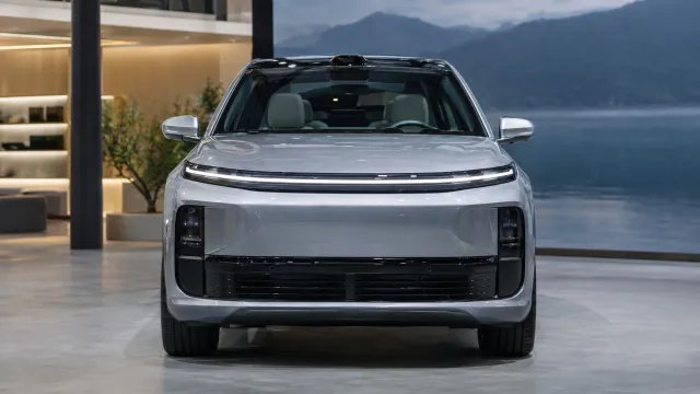 A silver Li i6 electric SUV seen from the front on the Li Auto stand at the Beijing auto show in April 2026. AI-generated illustration.