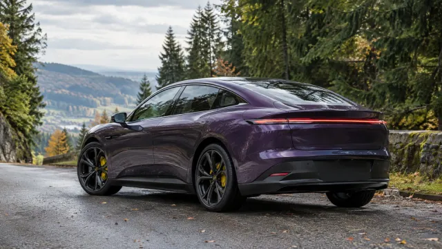 A purple Xpeng L03 mid-size electric liftback parked on a Black Forest road with yellow brake callipers and a continuous rear light strip visible. AI-generated illustration.